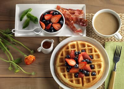 Breakfast Waffle with Fruit, Bacon, and Coffee