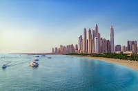 Beach near Dubai Marina with view of the skyline.