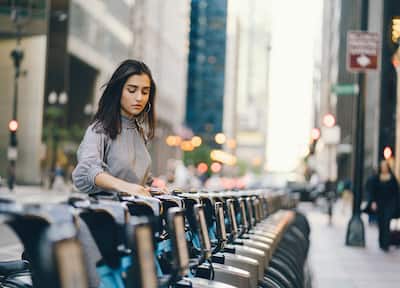 Young woman renting a bike in Chicago
