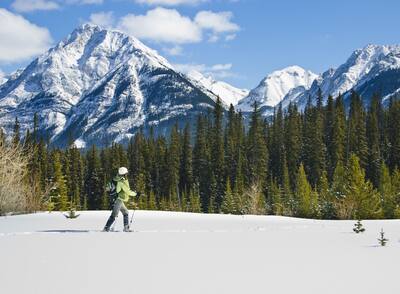 Woman hiking in snowshoes at Banff National Park, Canada