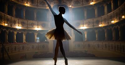 Silhouette of a young graceful classical ballet female dancer in white tutu is performing a choreography on classic theatre stage with dramatic lighting before start of a show.