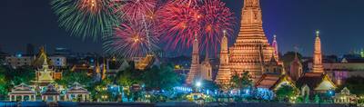 Wat arun and cruise ship in night time under new year celebration, Bangkok city ,Thailand