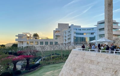 A group of people at an outside event on the terrace at the Getty Center in Los Angeles.
