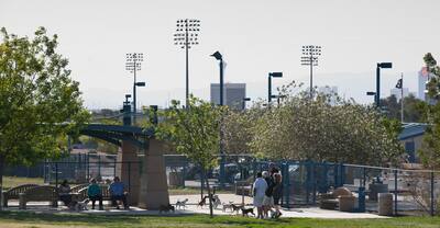 People and dogs enjoy a the Kellogg Zaher Sports Complex dog park in Las Vegas.