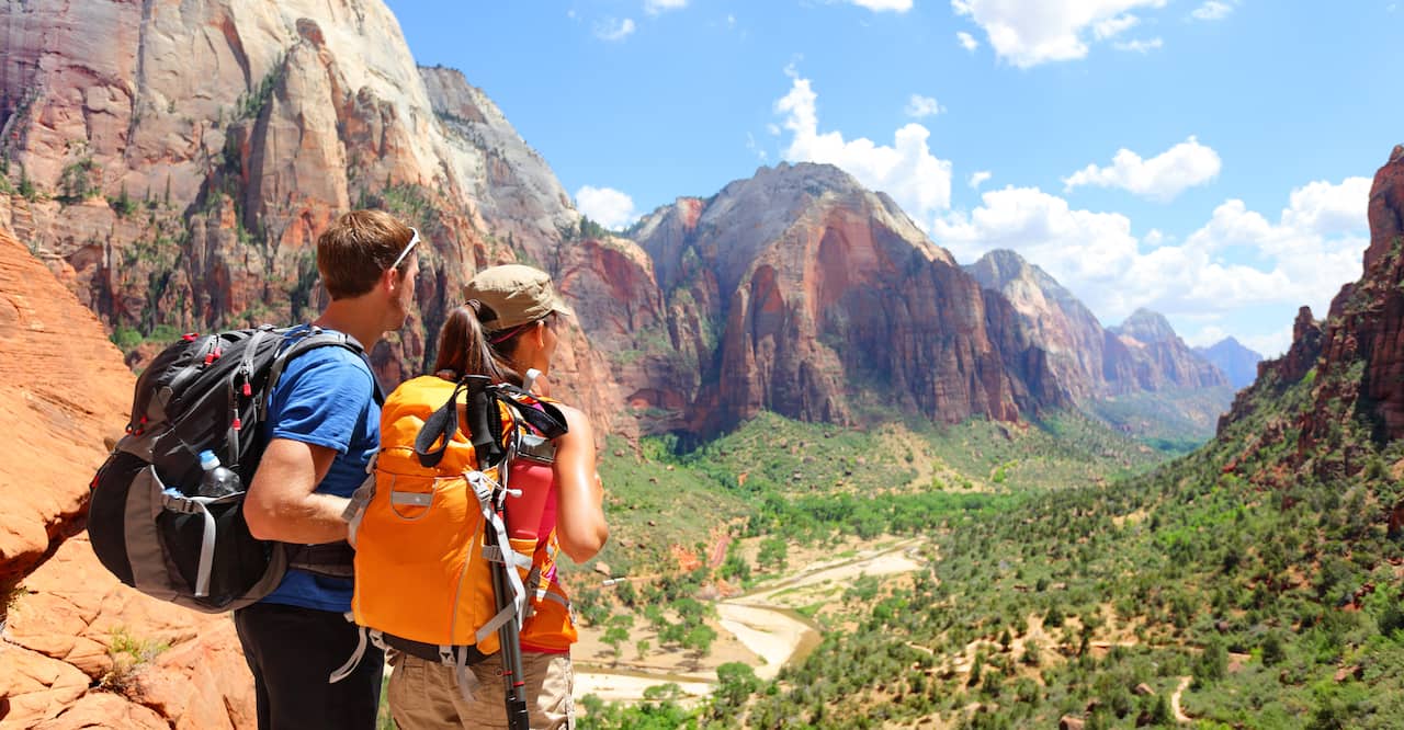 Hikers looking at view in Zion National park.