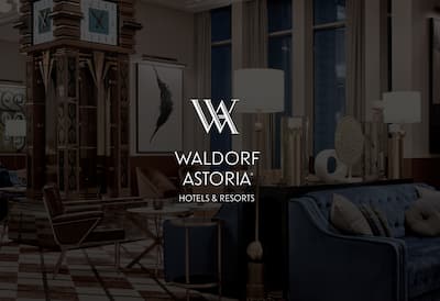 Hotel lounge area with the Waldorf Astoria Hotels & Resorts embossed over the image