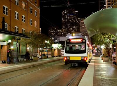 Dallas public transportation streetcar at night.