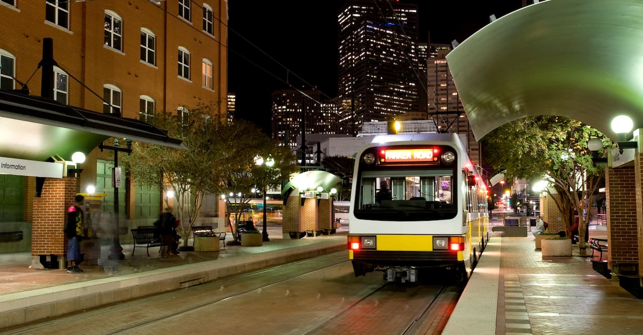 Dallas public transportation streetcar at night.