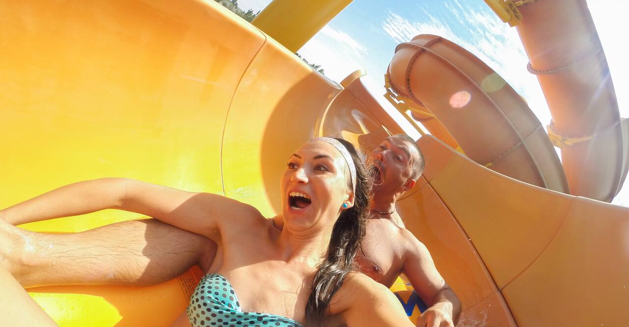 scared couple on extreme water slide