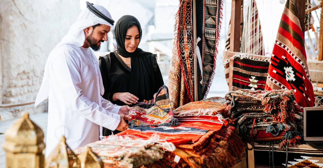 Man and woman shopping in Dubai.