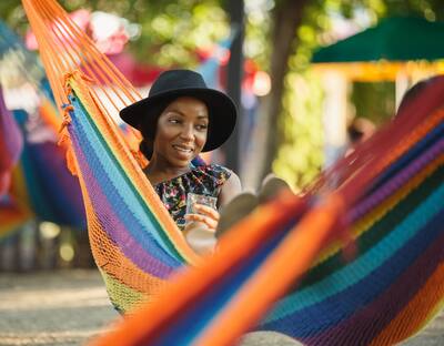 Woman relaxes in hammock at Spruce Street Harbor Park