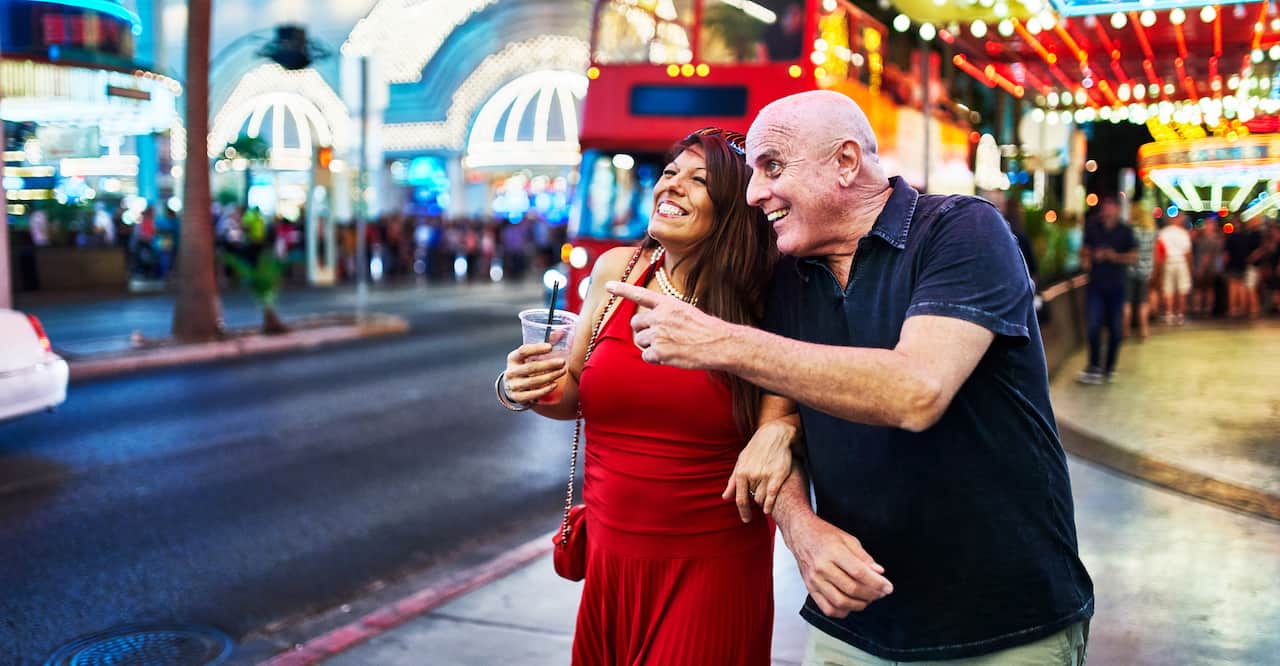Older couple sightseeing on the strip in Las Vegas. 