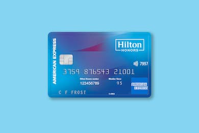 Hilton Honors American Express Card on a blue background