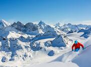Skiing with amazing view of Swiss famous mountains in beautiful winter snow.