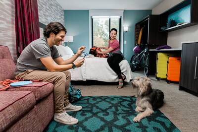 Couple in a room with their dog