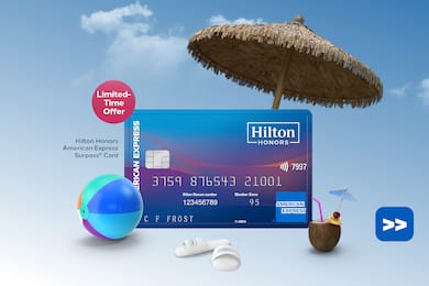 Hilton Honors American Express Surpass Card floating on a sky background