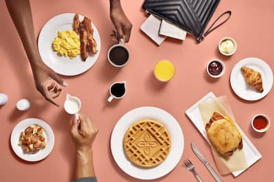 HGI overhead shot of a table with breakfast food and coffee.