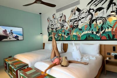 Woman lying on bed with her legs in a pointed position.