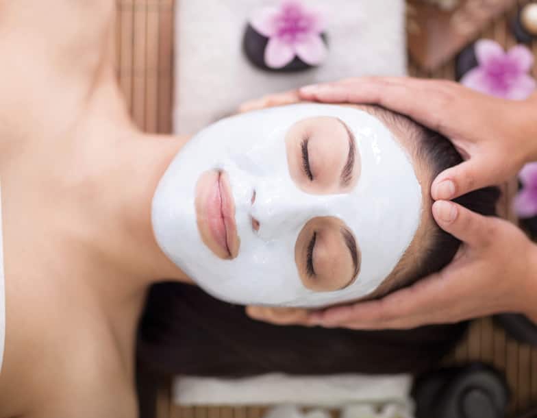 Woman Receiving Spa Facial and Massage