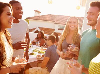 Group of Friends Enjoying Drinks at Outdoor Party