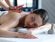 Woman Receiving Massage on Spa Table