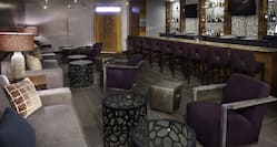 Soft Seating in Lounge Area and Counter Seating at Fully Stocked Prime 1079 Bar WIth TVs