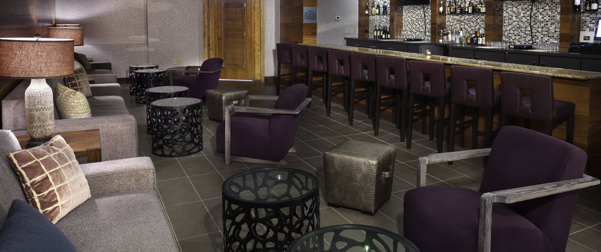 Soft Seating in Lounge Area and Counter Seating at Fully Stocked Prime 1079 Bar WIth TVs