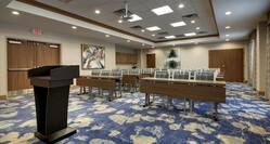 Large Meeting Room with Classroom Setup and Podium