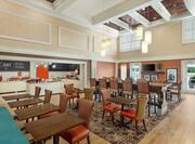Spacious breakfast seating area featuring ample natural light and complimentary buffet.