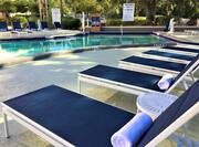 Outdoor Swimming Pool Area with Deck Chairs