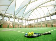 Indoor Tennis Court with Tennis Racket and Tennis Ball