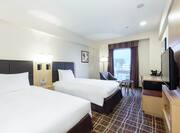 Deluxe Guestroom with Two Twin Beds, Lounge Area, Outside View, Work Desk, and Room Technology