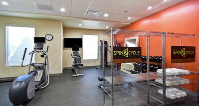 Fitness area with machines and weights.