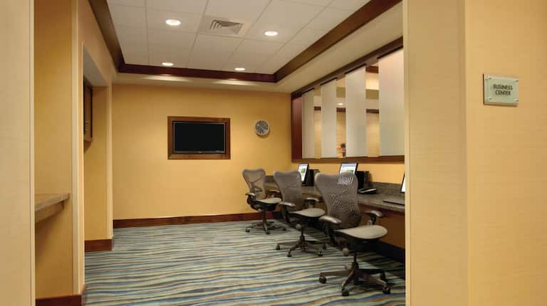 Business Center With TV and Three Computer Workstations with Rolling Chairs