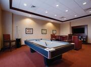 Game Room With Pool Table, Bar Style Seating, Sofa, TV and Wall Art