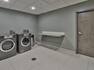 Guest Laundry Room with Washer, Dryer and Counter