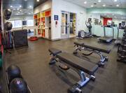 Fitness Area with Weight Balls, Benches, Free Weights and Cardio Equipment