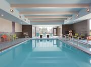 Indoor Pool With Chairs, Loungers, Towel Station, Windows
