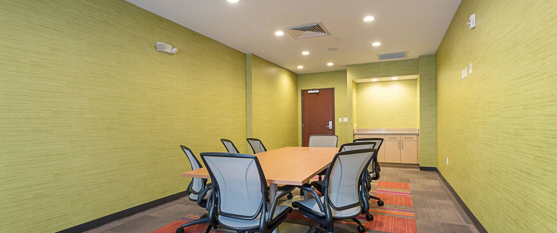 Boardroom Table With Seating for 8 in Green Room Meeting Room