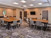Meeting Room with Tables, Chairs, Beverage Station and Wall Mounted HDTV