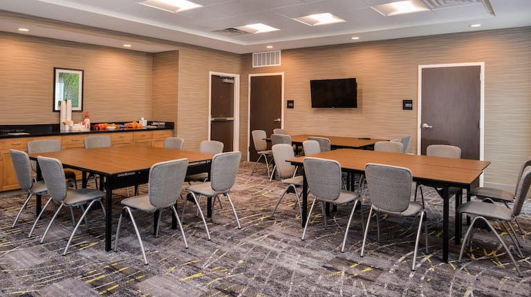 Meeting Room with Tables, Chairs, Beverage Station and Wall Mounted HDTV