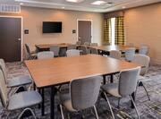 Meeting Room with Tables, Chairs and Wall Mounted HDTV