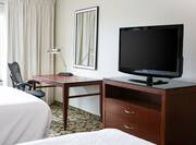 Two Queen Beds Guest Room Desk And TV
