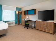 desk and TV in king studio suite