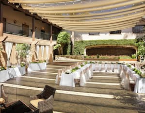 an outdoor wedding table and reception set up