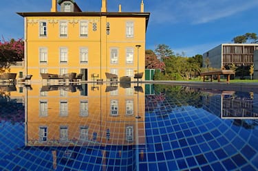 View of Hotel Exterior Reflected on the Water