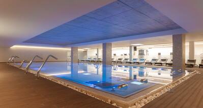 Indoor Pool with Seating Area at the Spa