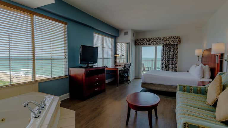 King Guestroom with Bed, Lounge Area, Room Technology, Outside View, Work Desk, and Hot Tub