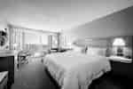 King Bed and Balcony in Guest Room