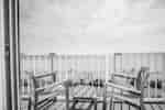 Comfortable Seating on Guest Room Balcony with Views of the Beach